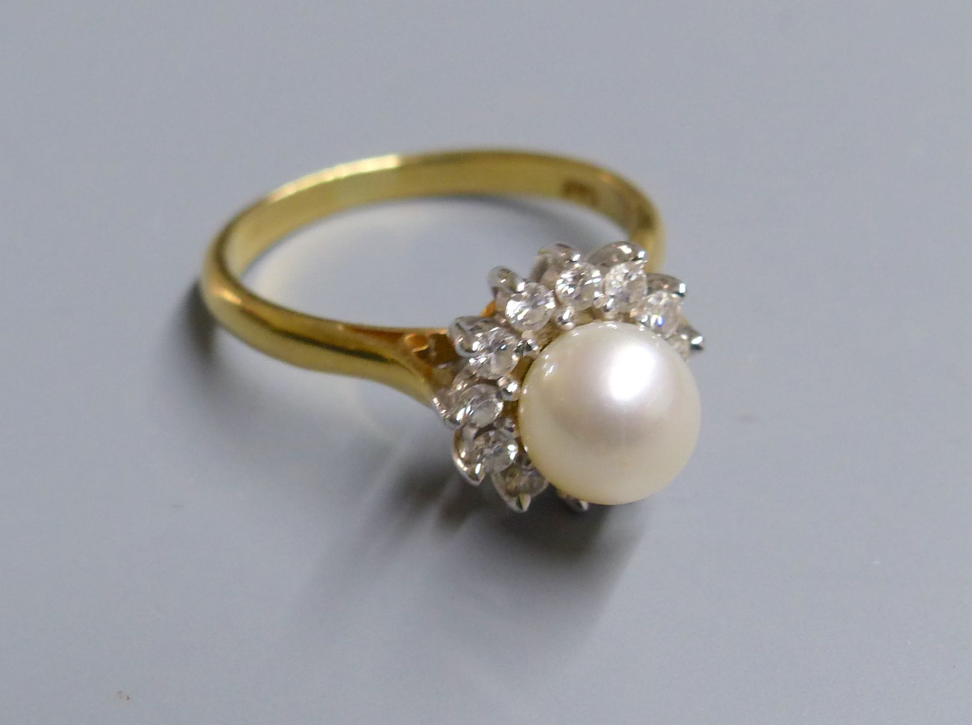 A modern 18ct gold, cultured pearl and diamond set cluster ring, size L, gross 4.4 grams.